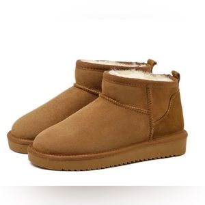 The Boston Mini Boots! Latest trend in women's boots. Size 6 1/2 New never worn.